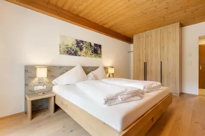 Ein Bett oder Betten in einem Zimmer der Unterkunft Hotel Garni Jagdhof