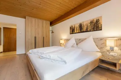 Ein Bett oder Betten in einem Zimmer der Unterkunft Hotel Garni Jagdhof