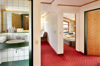 Ein Bett oder Betten in einem Zimmer der Unterkunft Sporthotel Kogler