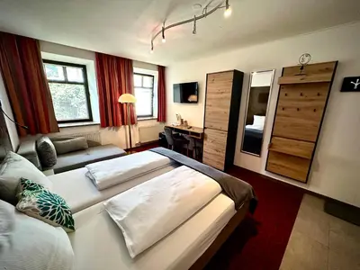Ein Bett oder Betten in einem Zimmer der Unterkunft Bed & Rooms, Wörgl