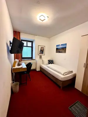 Ein Bett oder Betten in einem Zimmer der Unterkunft Bed & Rooms, Wörgl
