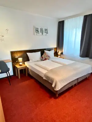 Ein Bett oder Betten in einem Zimmer der Unterkunft Bed & Rooms, Wörgl