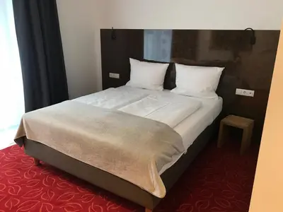 Ein Bett oder Betten in einem Zimmer der Unterkunft Bed & Rooms, Wörgl