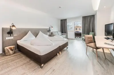 Ein Bett oder Betten in einem Zimmer der Unterkunft Lifesport Hotel Hechenmoos