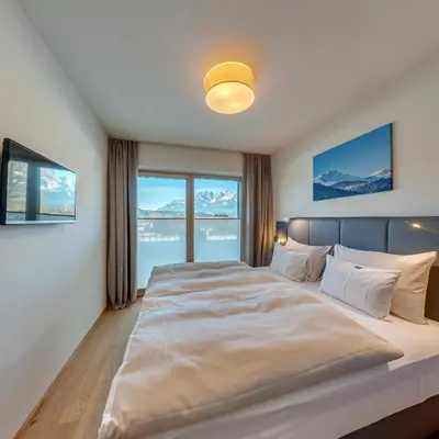 Ein Bett oder Betten in einem Zimmer der Unterkunft das Stefan - Ferienwohnungen in den Kitzbüheler Alpen
