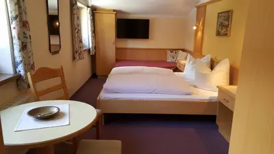 Ein Bett oder Betten in einem Zimmer der Unterkunft Gästehaus Wallner