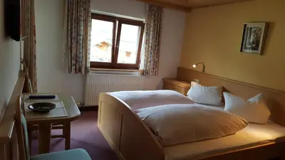 Ein Bett oder Betten in einem Zimmer der Unterkunft Gästehaus Wallner