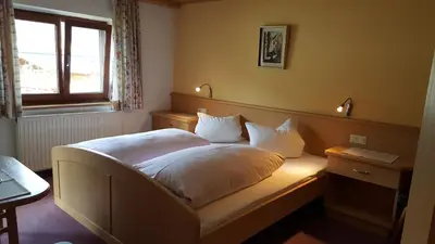 Ein Bett oder Betten in einem Zimmer der Unterkunft Gästehaus Wallner