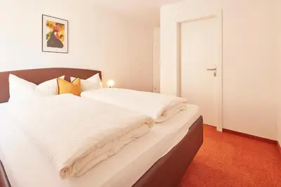 Ein Bett oder Betten in einem Zimmer der Unterkunft Gästehaus Kulmer