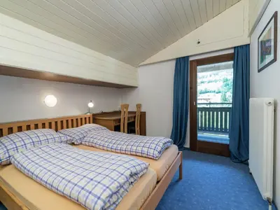 Ein Bett oder Betten in einem Zimmer der Unterkunft Apartment in Niedernsill near Zell am See Ski Lift