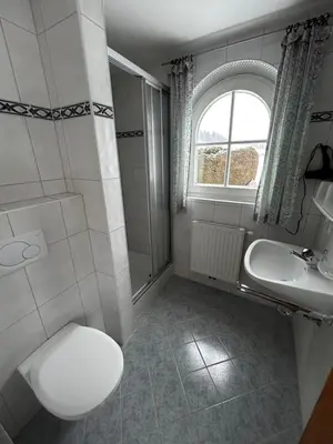 Ein Badezimmer in der Unterkunft Haus Waldegg