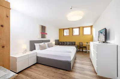 Ein Bett oder Betten in einem Zimmer der Unterkunft Apart-Garni Innerwiesn