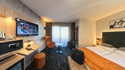 Ein Bett oder Betten in einem Zimmer der Unterkunft Vital & Sporthotel Brixen