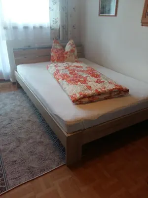 Ein Bett oder Betten in einem Zimmer der Unterkunft Ferienwohnung Roswitha