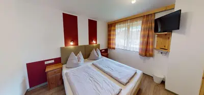 Ein Bett oder Betten in einem Zimmer der Unterkunft Ferienwohnung Thanner