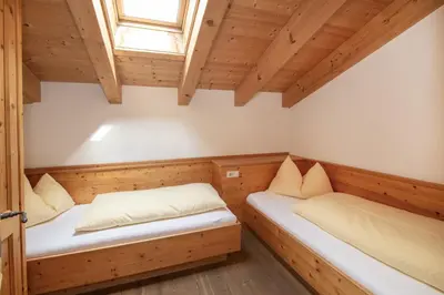 Ein Bett oder Betten in einem Zimmer der Unterkunft Gästehaus Larch