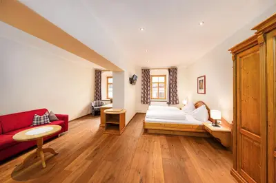 Ein Bett oder Betten in einem Zimmer der Unterkunft Hotel Heitzmann