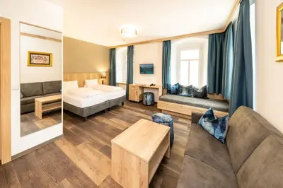Ein Bett oder Betten in einem Zimmer der Unterkunft Hotel Heitzmann