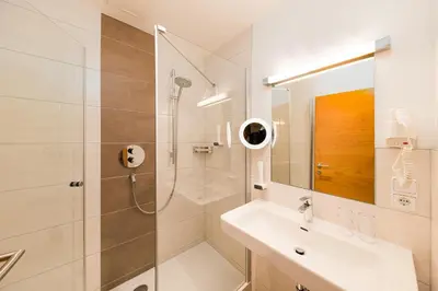 Ein Badezimmer in der Unterkunft Hotel Heitzmann