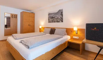 Ein Bett oder Betten in einem Zimmer der Unterkunft Pension Haus in der Sonne