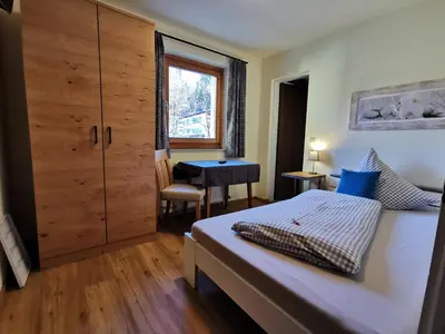 Ein Bett oder Betten in einem Zimmer der Unterkunft Pension Haus in der Sonne