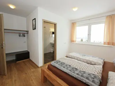 Ein Bett oder Betten in einem Zimmer der Unterkunft Holiday Home Zell am Ziller Ski Lift