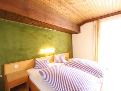 Ein Bett oder Betten in einem Zimmer der Unterkunft Spacious Apartment near Ski Area in Mittersill