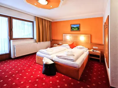 Ein Bett oder Betten in einem Zimmer der Unterkunft Hotel Theresia
