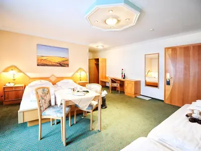 Ein Bett oder Betten in einem Zimmer der Unterkunft Hotel Theresia