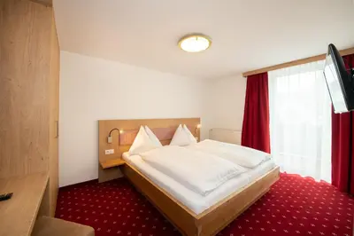 Ein Bett oder Betten in einem Zimmer der Unterkunft Hotel Gasthof Kröll, 4 Skigebiete in unmittelbarer Nähe, Restaurant mit regionaler Küche