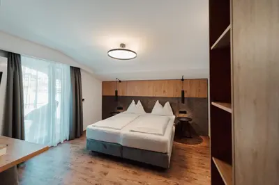 Ein Bett oder Betten in einem Zimmer der Unterkunft Hotel Tannenberg