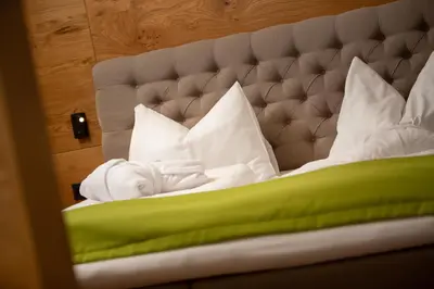 Ein Bett oder Betten in einem Zimmer der Unterkunft Hotel Tannenberg