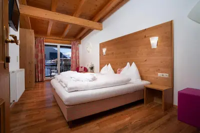 Ein Bett oder Betten in einem Zimmer der Unterkunft Hotel Tannenberg
