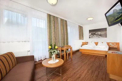 Ein Bett oder Betten in einem Zimmer der Unterkunft Hotel Grundlhof