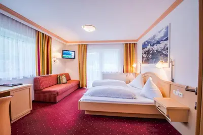 Ein Bett oder Betten in einem Zimmer der Unterkunft Hotel Grundlhof