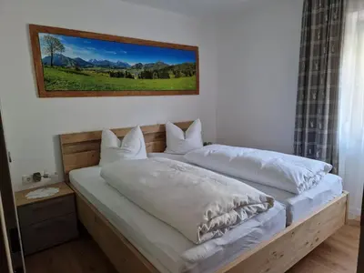 Ein Bett oder Betten in einem Zimmer der Unterkunft Haus Bergblick