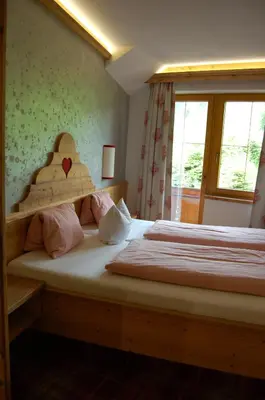 Ein Bett oder Betten in einem Zimmer der Unterkunft Hotel Schweizerhof