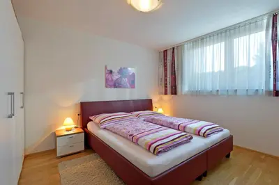 Ein Bett oder Betten in einem Zimmer der Unterkunft Alpenchalets Wilder Kaiser