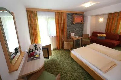 Ein Bett oder Betten in einem Zimmer der Unterkunft Hotel Eder Michaela