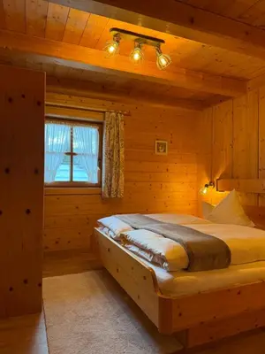 Ein Bett oder Betten in einem Zimmer der Unterkunft Steigerhütte