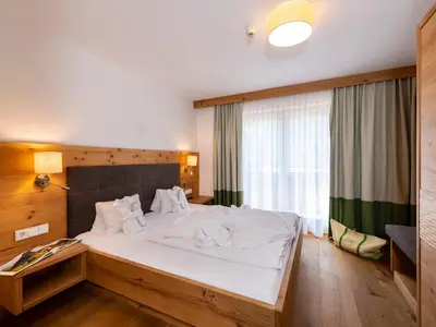 Ein Bett oder Betten in einem Zimmer der Unterkunft Hotel Kitzspitz