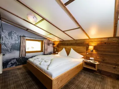 Ein Bett oder Betten in einem Zimmer der Unterkunft Hotel Kitzspitz