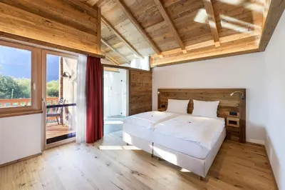 Ein Bett oder Betten in einem Zimmer der Unterkunft Golf- und Sporthotel Moarhof