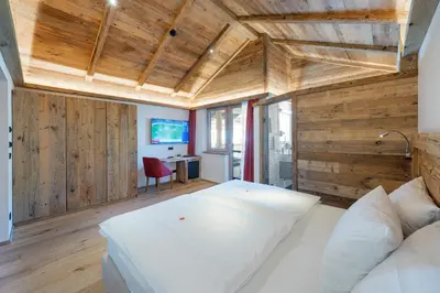 Ein Bett oder Betten in einem Zimmer der Unterkunft Golf- und Sporthotel Moarhof