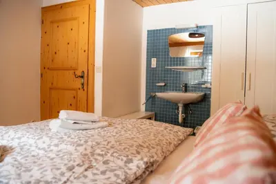 Ein Bett oder Betten in einem Zimmer der Unterkunft Ferienhaus am Gebraweg in Fieberbrunn in Tirol - Saalbach, Leogang, Hochfilzen, Kitzbühel