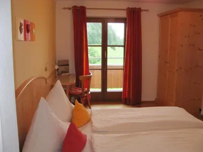 Ein Bett oder Betten in einem Zimmer der Unterkunft Wanishof