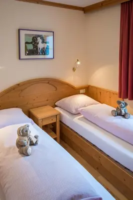Ein Bett oder Betten in einem Zimmer der Unterkunft Appartementhaus Alpenrose