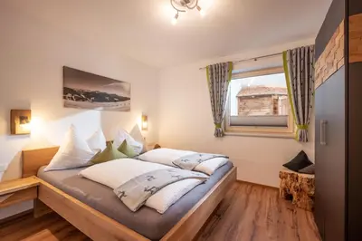 Ein Bett oder Betten in einem Zimmer der Unterkunft Apart Bergluft