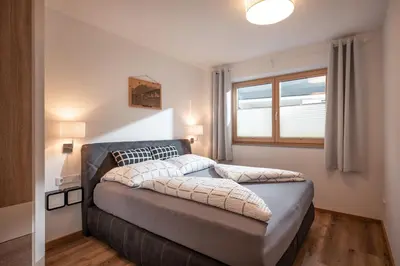 Ein Bett oder Betten in einem Zimmer der Unterkunft Apart Alpenrose