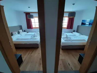Ein Bett oder Betten in einem Zimmer der Unterkunft Alpin Residenz Panoramabahn Kitzbühel